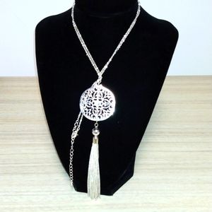 Long silvertone chain ,pendant and tassel..